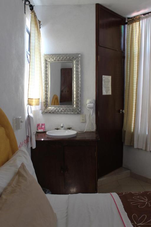 Postel nebo postele na pokoji v ubytování Hotel Posada Chamacuero