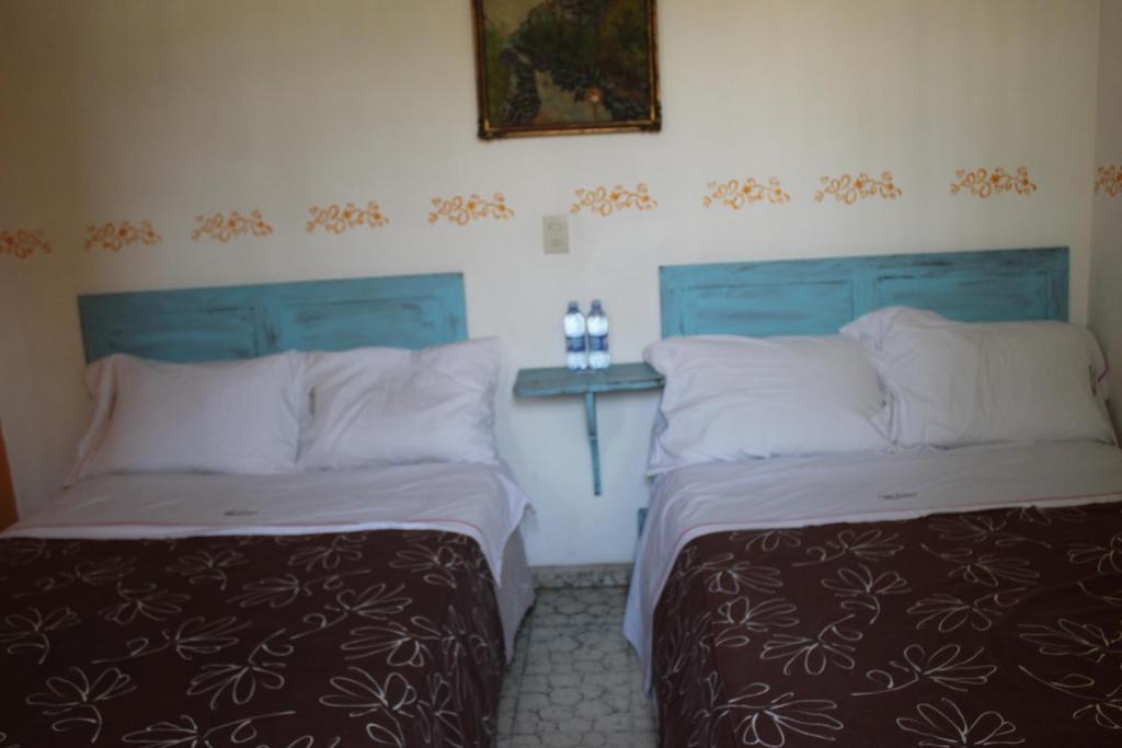 Postel nebo postele na pokoji v ubytování Hotel Posada Chamacuero