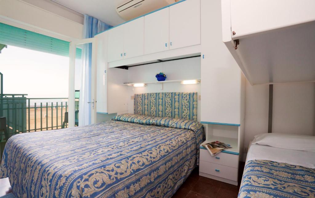 Postel nebo postele na pokoji v ubytování Hotel Sanremo