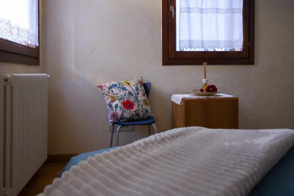 Łóżko lub łóżka w pokoju w obiekcie Venice Apartment