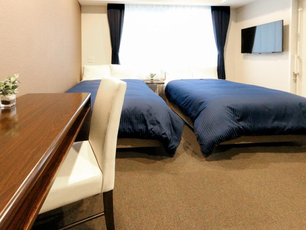 TV a/nebo společenská místnost v ubytování HOTEL LiVEMAX Kayabacho