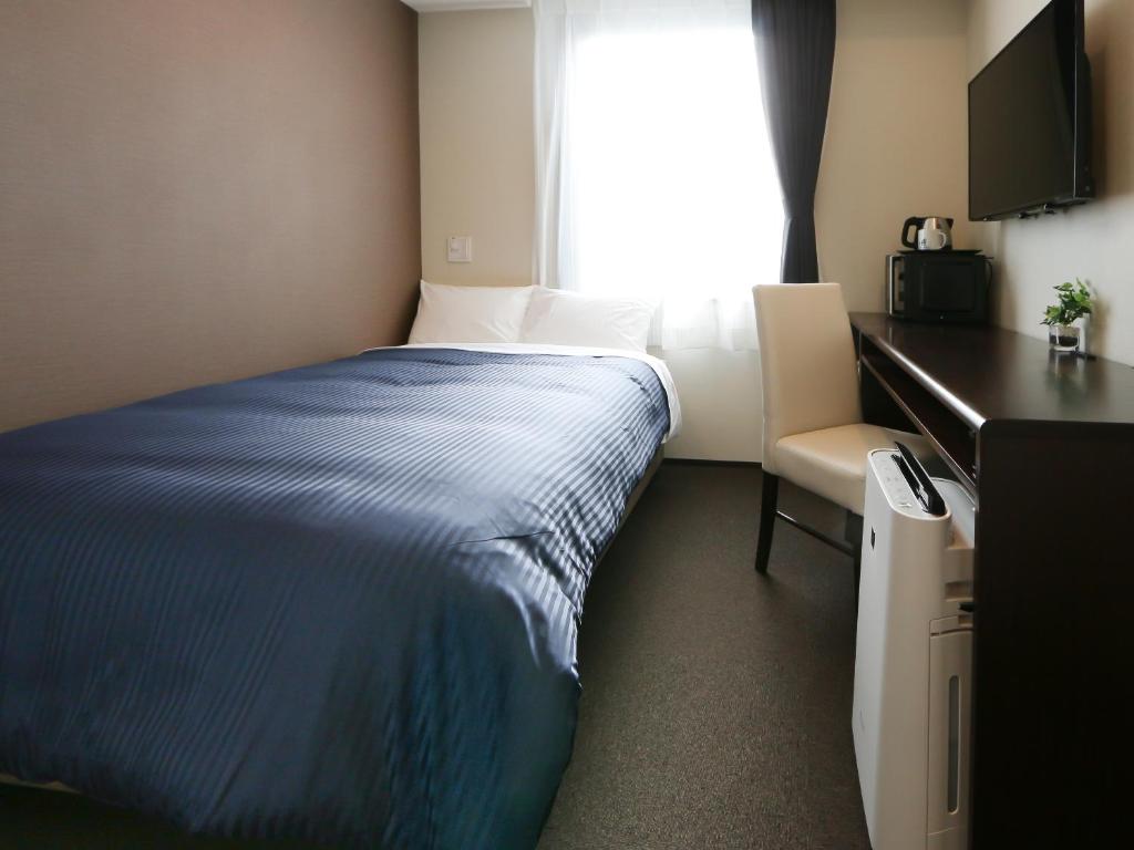 TV a/nebo společenská místnost v ubytování HOTEL LiVEMAX Kayabacho