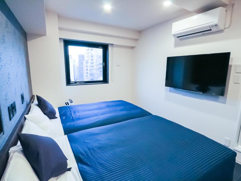 TV a/nebo společenská místnost v ubytování HOTEL LiVEMAX Tokyo Shintomicho