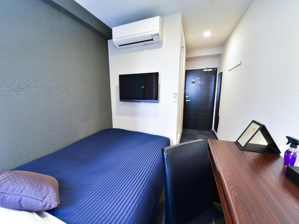 TV a/nebo společenská místnost v ubytování HOTEL LiVEMAX Toyosu-Ekimae