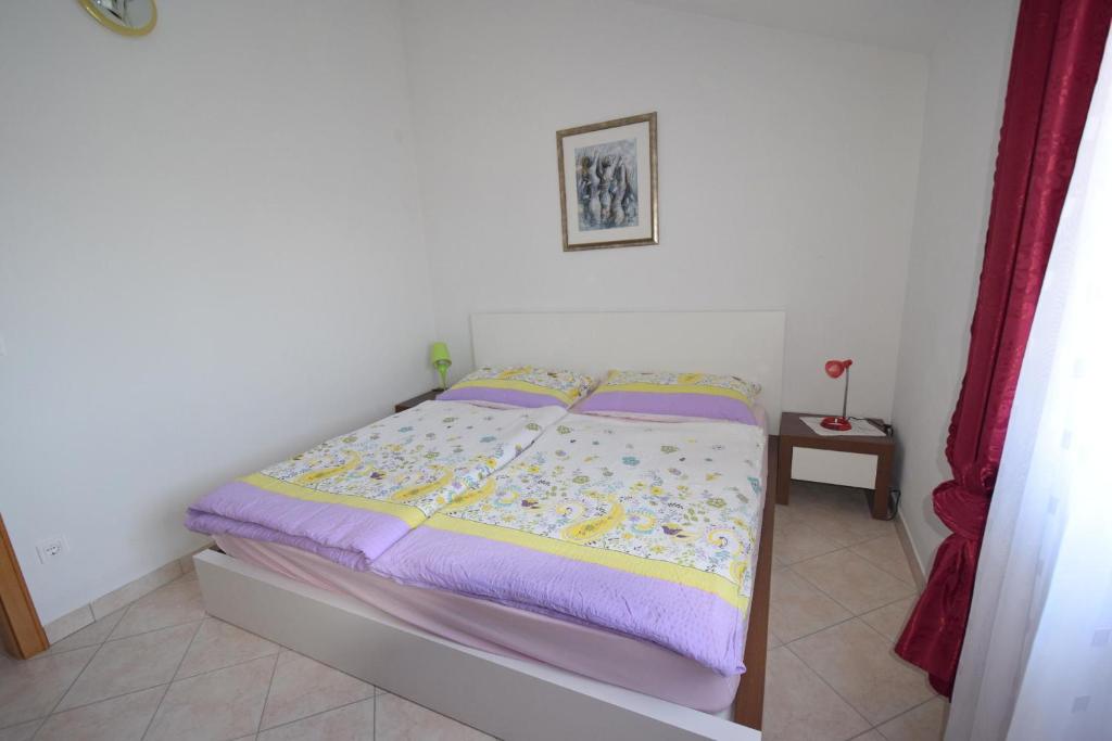 Łóżko lub łóżka w pokoju w obiekcie Apartments Gabrijel
