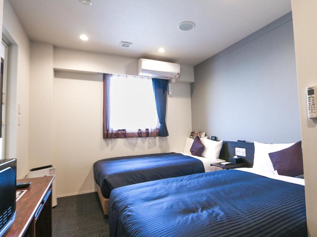TV a/nebo společenská místnost v ubytování HOTEL LiVEMAX Tokyo Ayase-Ekimae