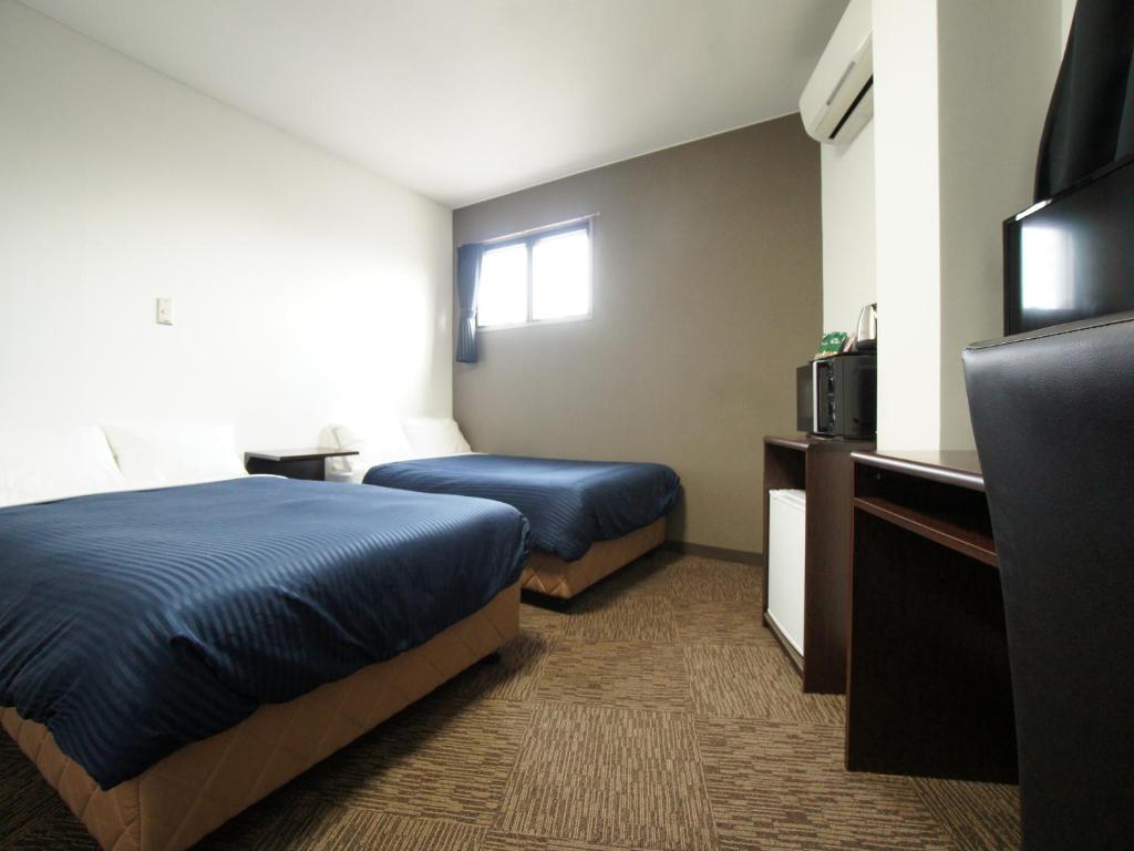TV a/nebo společenská místnost v ubytování HOTEL LiVEMAX BUDGET Gunma Numata