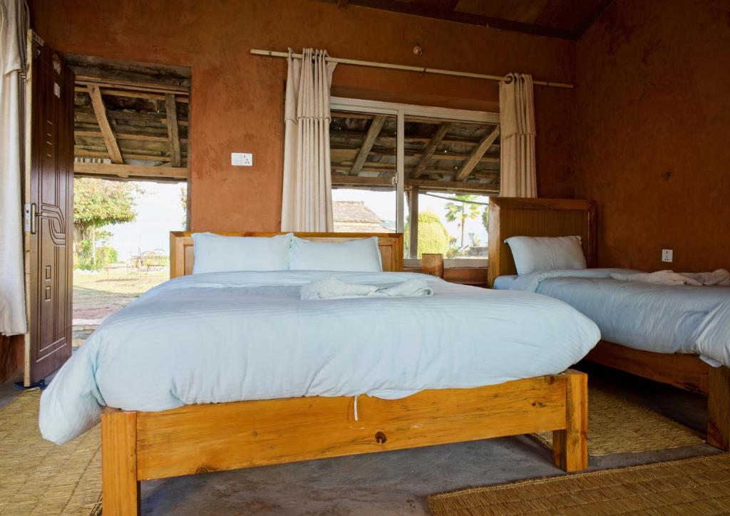 Letto o letti in una camera di Annapurna Eco Village