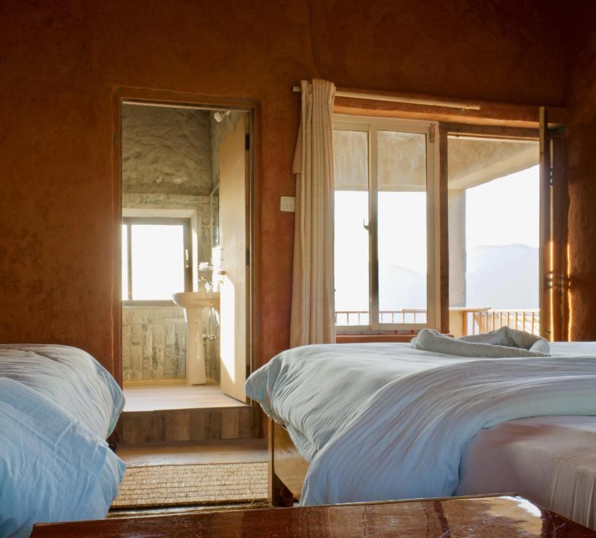 Letto o letti in una camera di Annapurna Eco Village