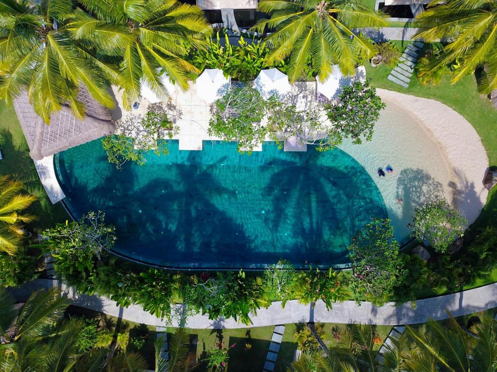 an overhead view of a swimming pool at a resort at Jivana Resort in Kuta Lombok