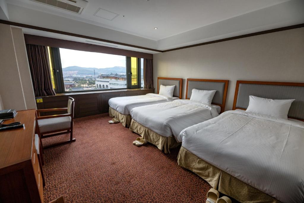 Postel nebo postele na pokoji v ubytování The K Hotel Gyeongju