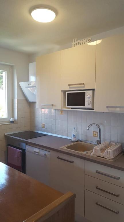 Kuchyň nebo kuchyňský kout v ubytování Apartment Petricic