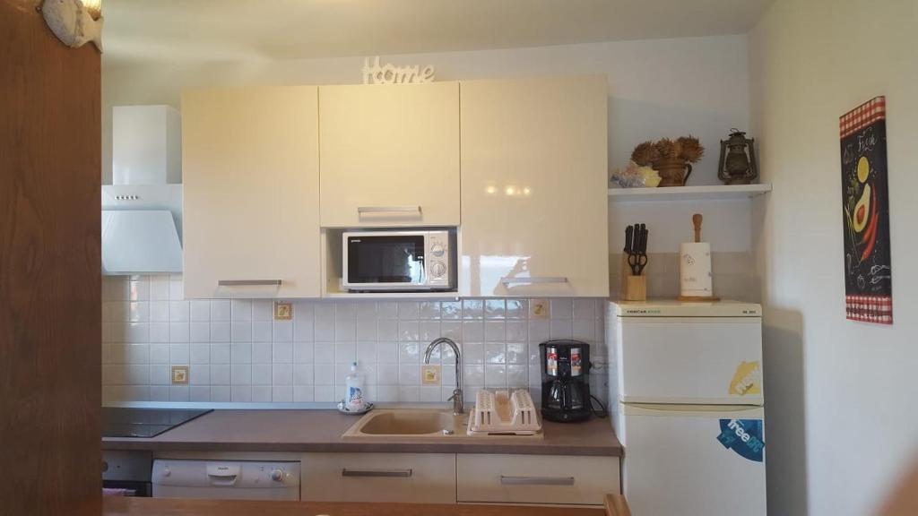 Kuchyň nebo kuchyňský kout v ubytování Apartment Petricic