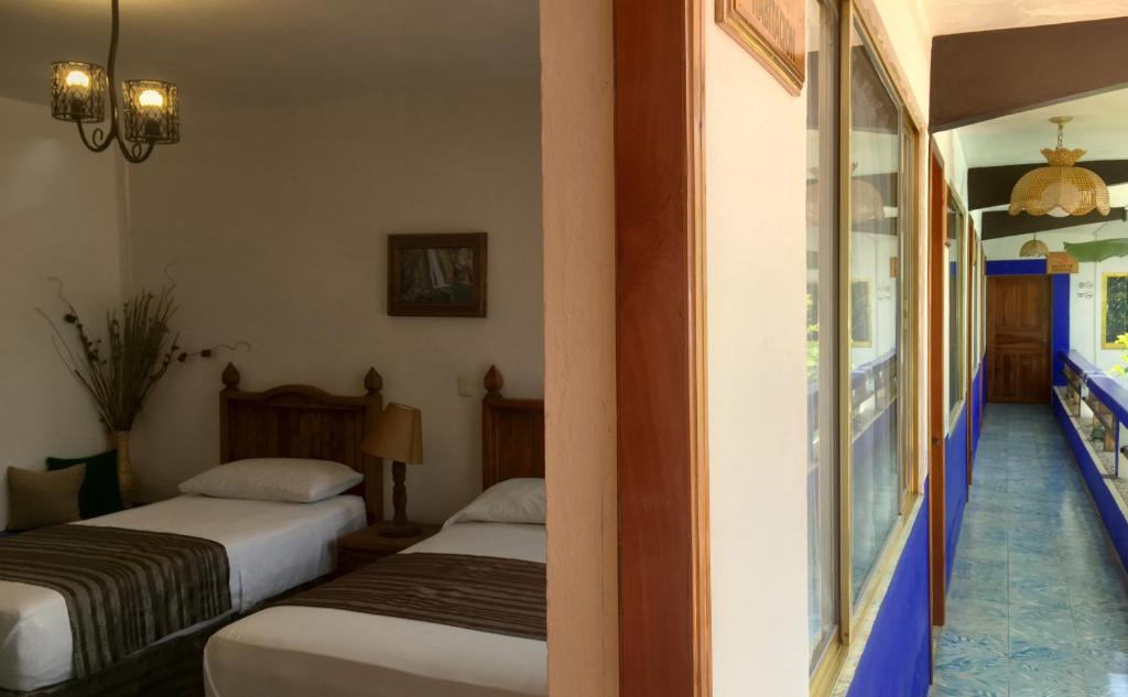 Letto o letti in una camera di Hostal Plaza Central