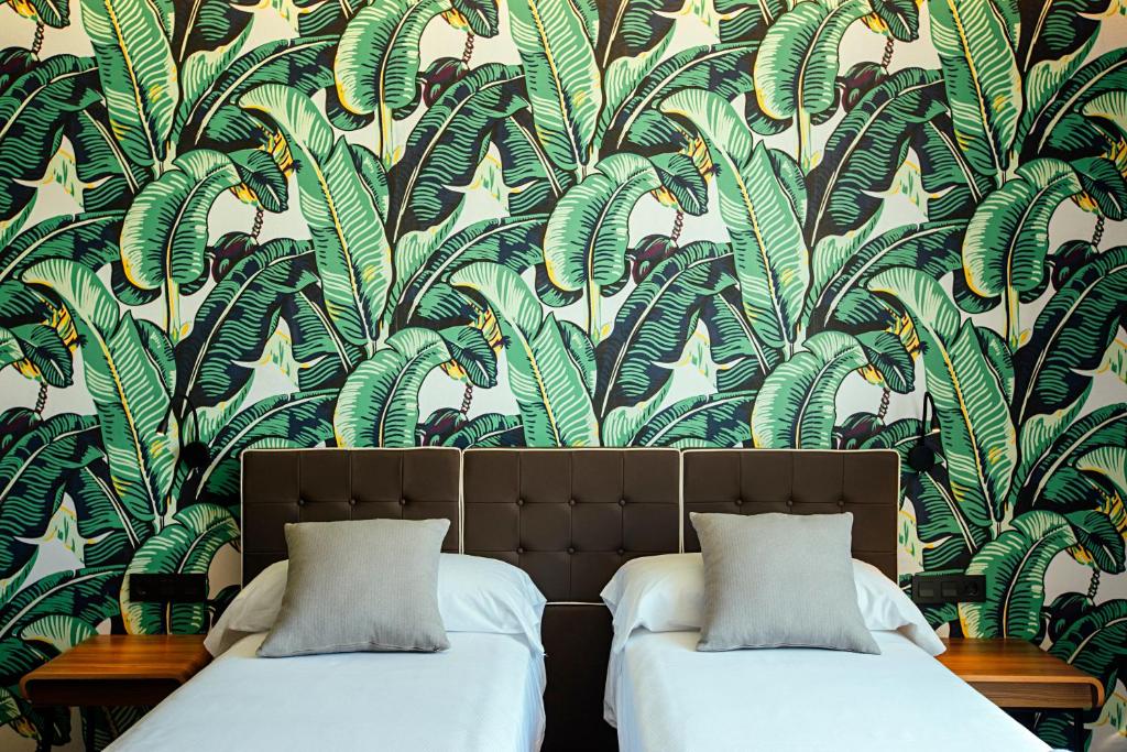 Posteľ alebo postele v izbe v ubytovaní Málaga Premium Hotel