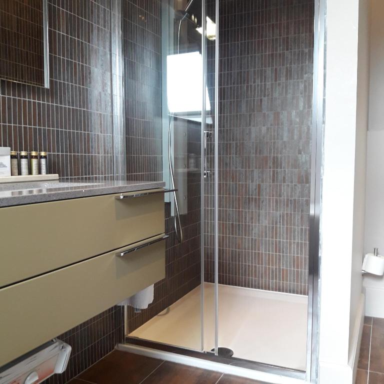 Koupelna v ubytování Hotel Recour