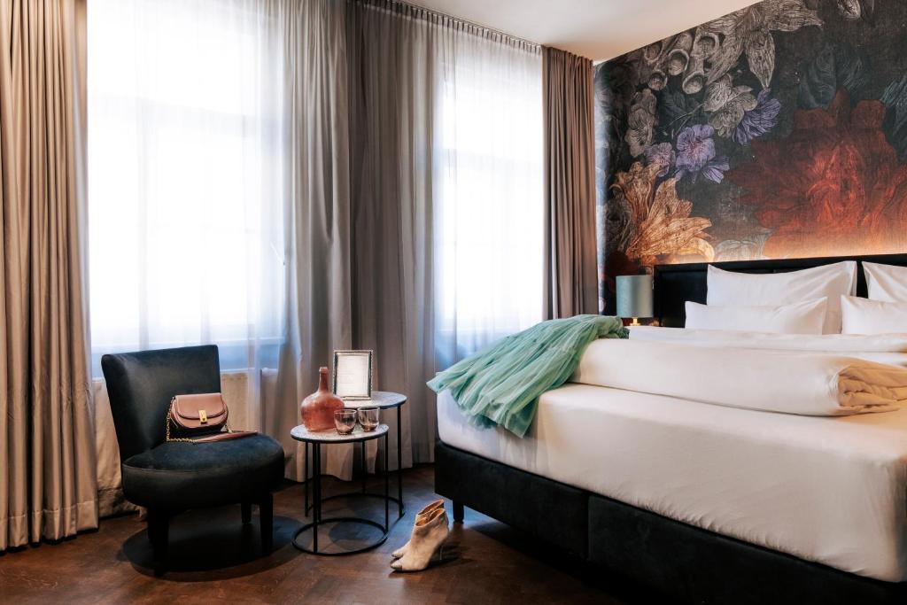 Postel nebo postele na pokoji v ubytování Aiola Living Graz