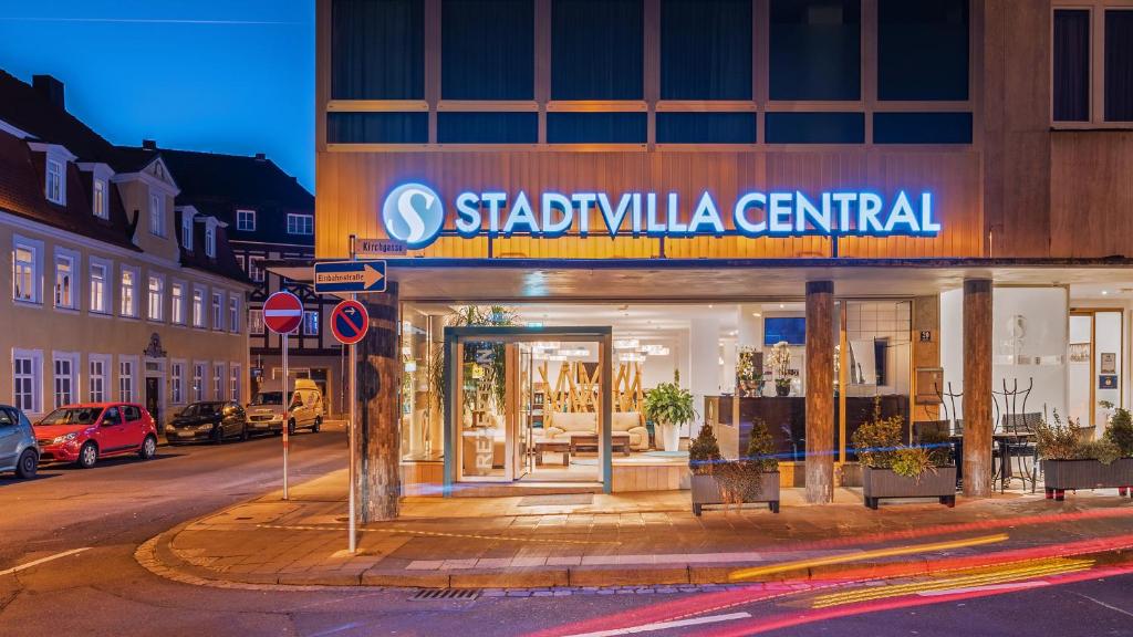 a store with a sign on the side of a street at Hotel - Stadtvilla Central in Schweinfurt