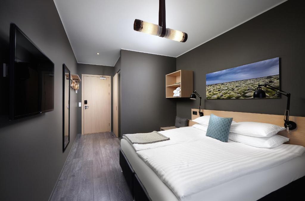 Postel nebo postele na pokoji v ubytování Alda Hotel Reykjavík