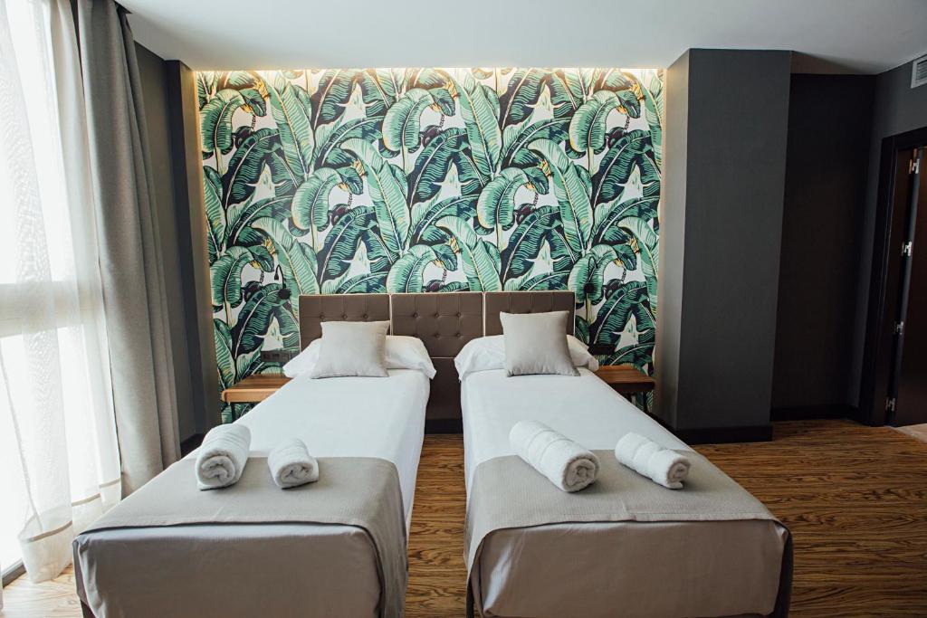 Posteľ alebo postele v izbe v ubytovaní Málaga Premium Hotel