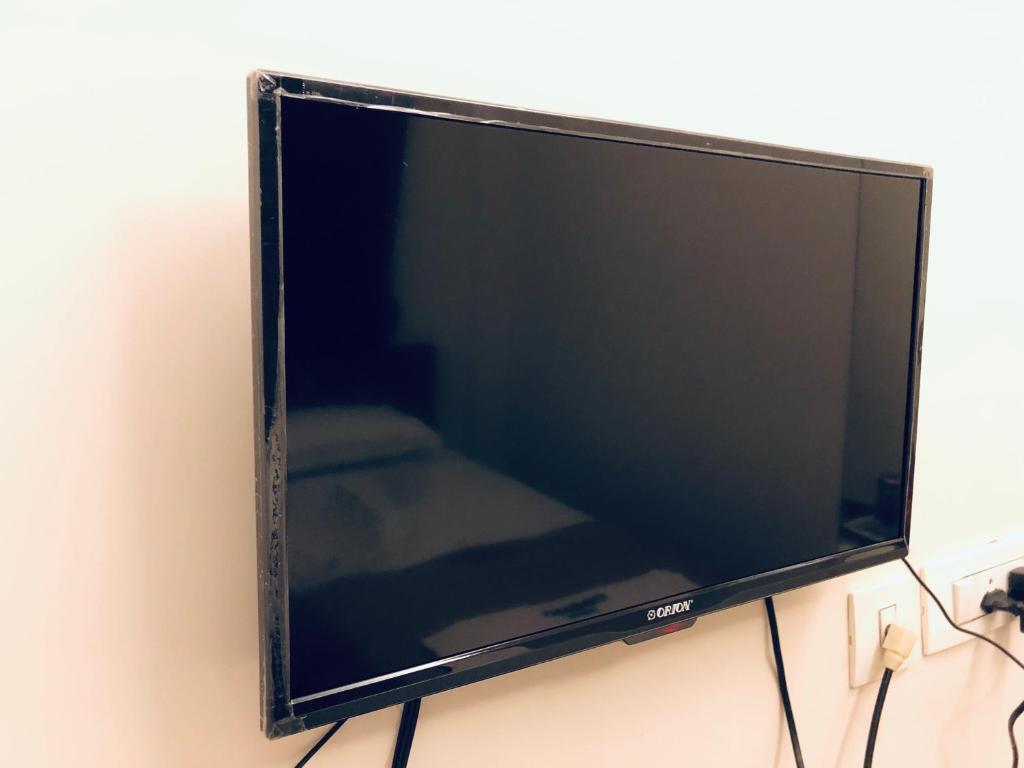 TV a/nebo společenská místnost v ubytování COSMO LODGE