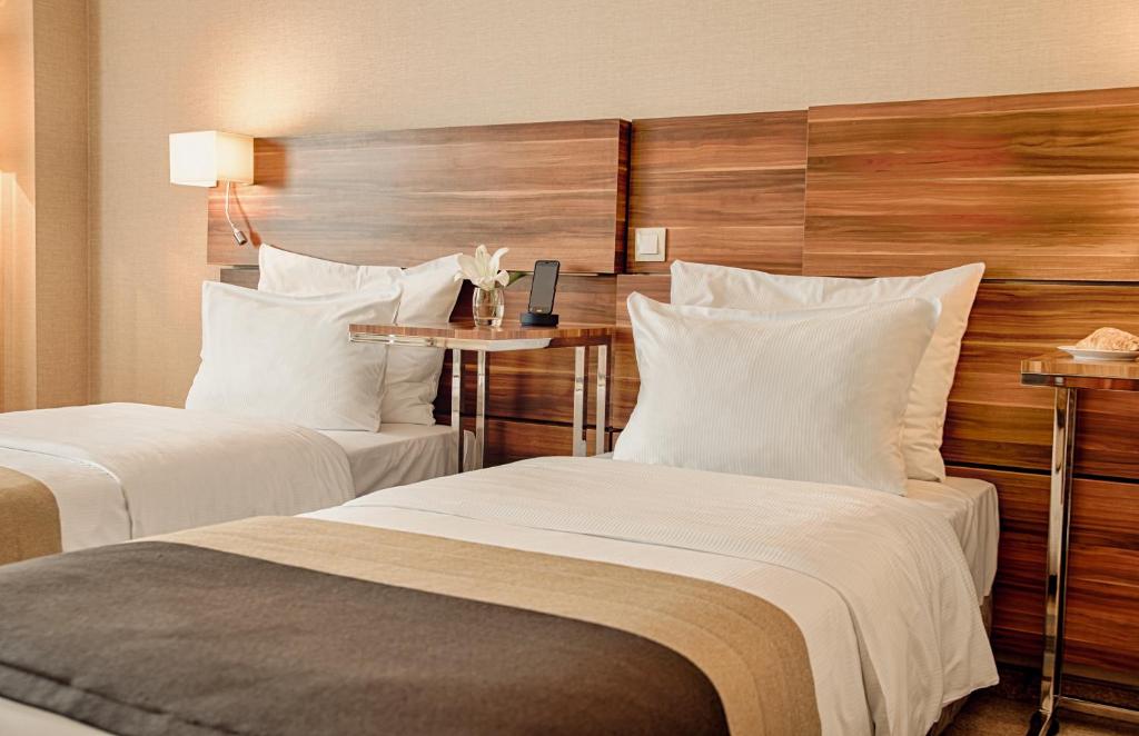 Posteľ alebo postele v izbe v ubytovaní Warsaw Plaza Hotel