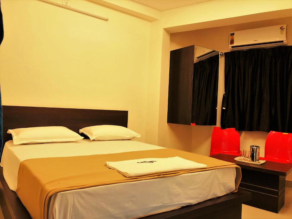 Postel nebo postele na pokoji v ubytování COSMO LODGE
