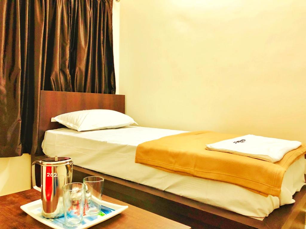 Postel nebo postele na pokoji v ubytování COSMO LODGE