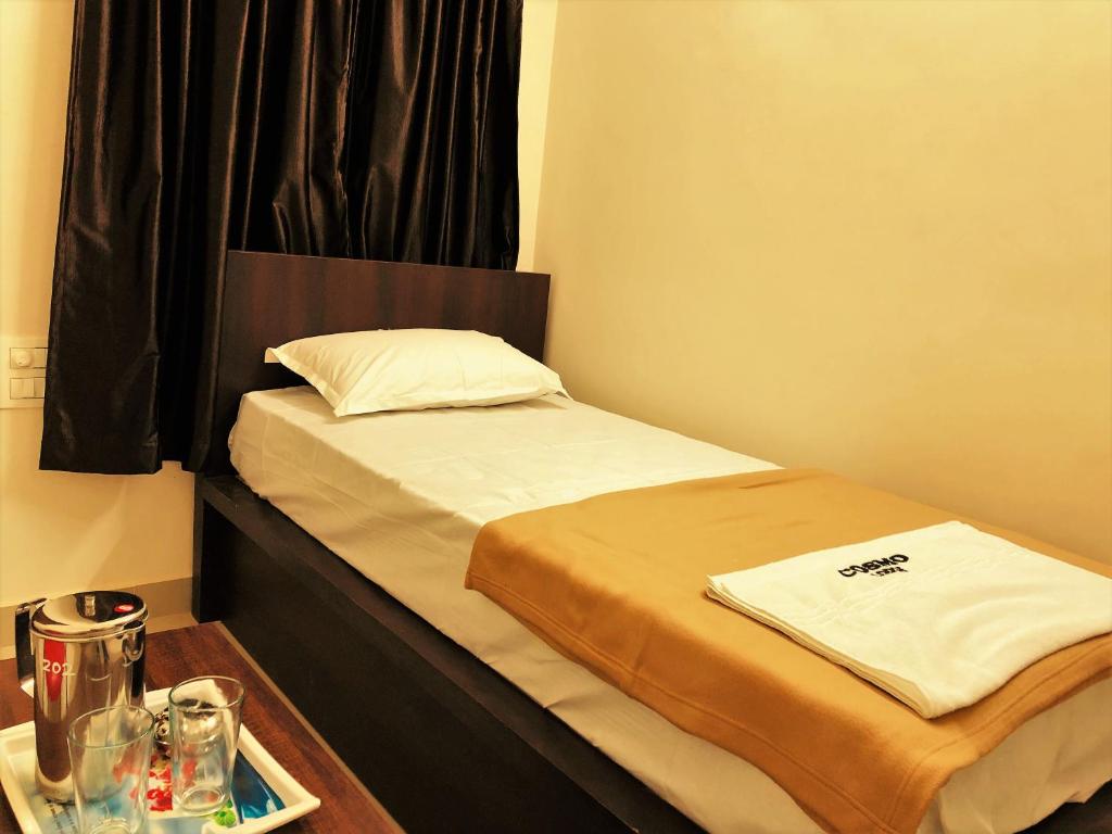 Postel nebo postele na pokoji v ubytování COSMO LODGE