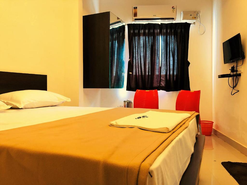 Postel nebo postele na pokoji v ubytování COSMO LODGE