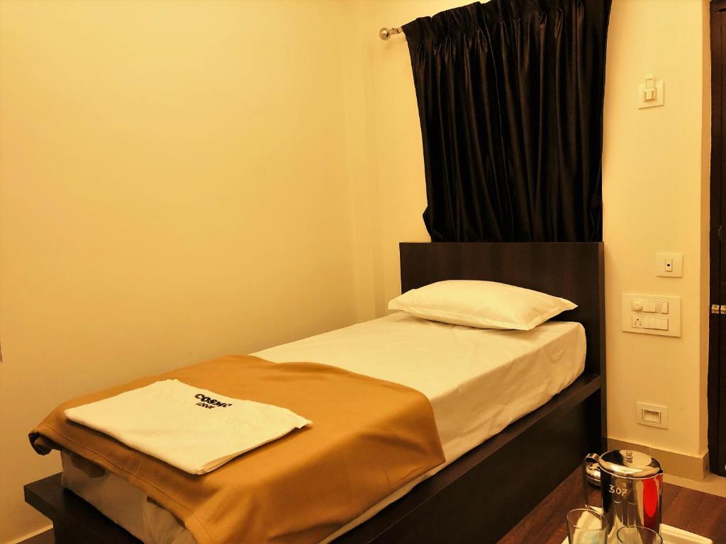 Postel nebo postele na pokoji v ubytování COSMO LODGE
