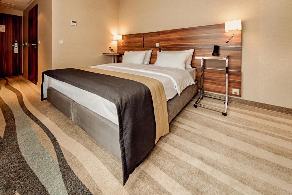 Posteľ alebo postele v izbe v ubytovaní Warsaw Plaza Hotel