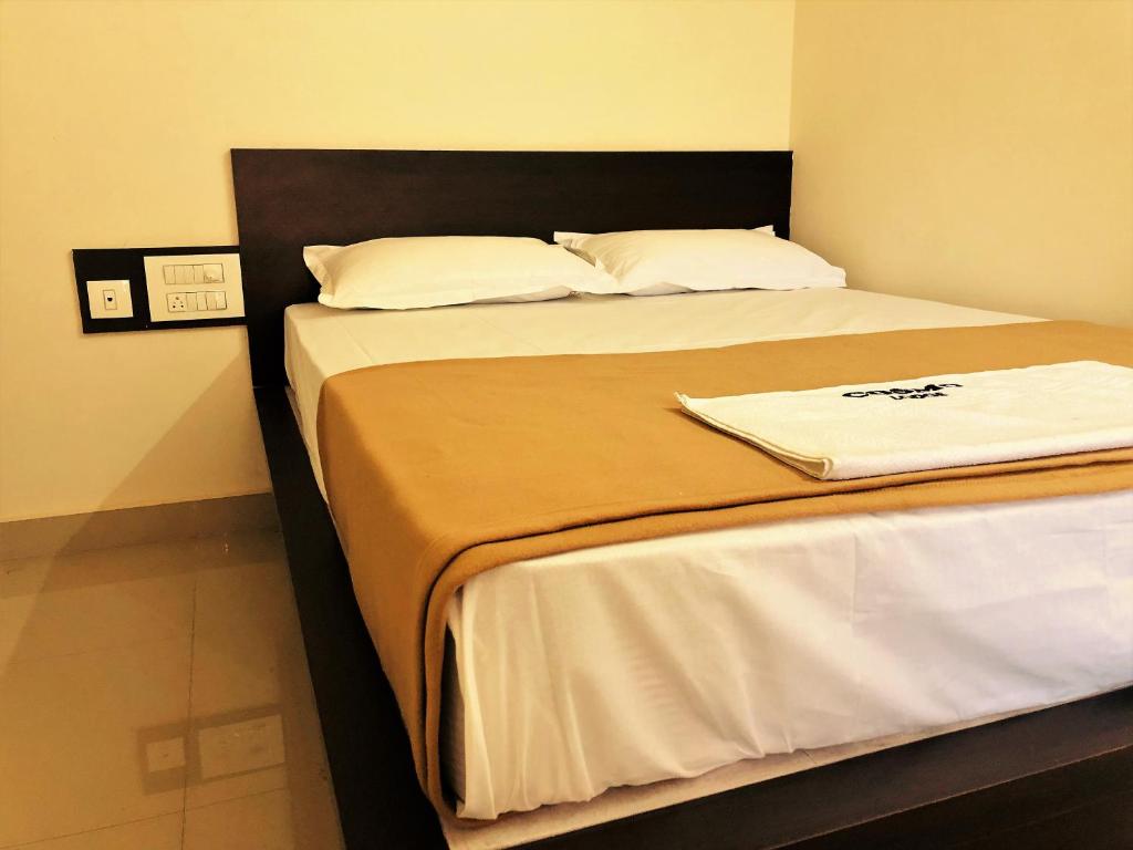 Postel nebo postele na pokoji v ubytování COSMO LODGE
