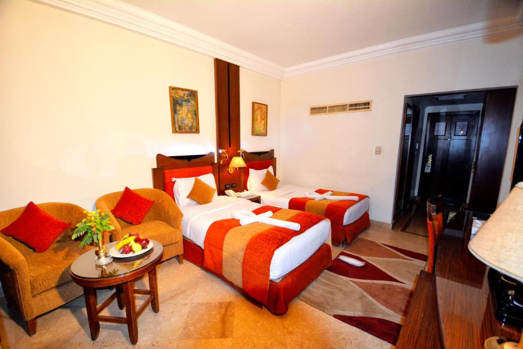 Postel nebo postele na pokoji v ubytování Aracan Eatabe Luxor Hotel