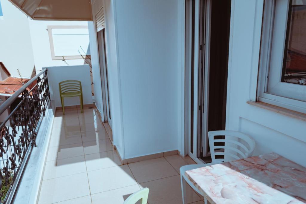 A bed or beds in a room at Sun Βy Τhe Sea 100m from the beach