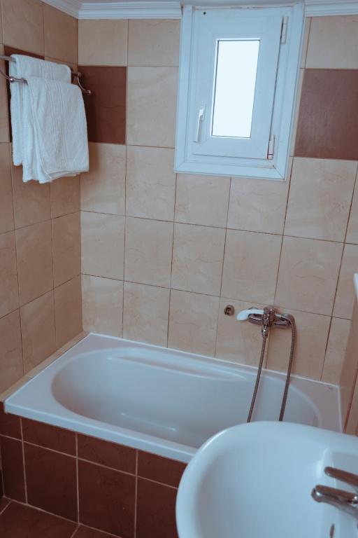 A bathroom at Sun Βy Τhe Sea 100m from the beach