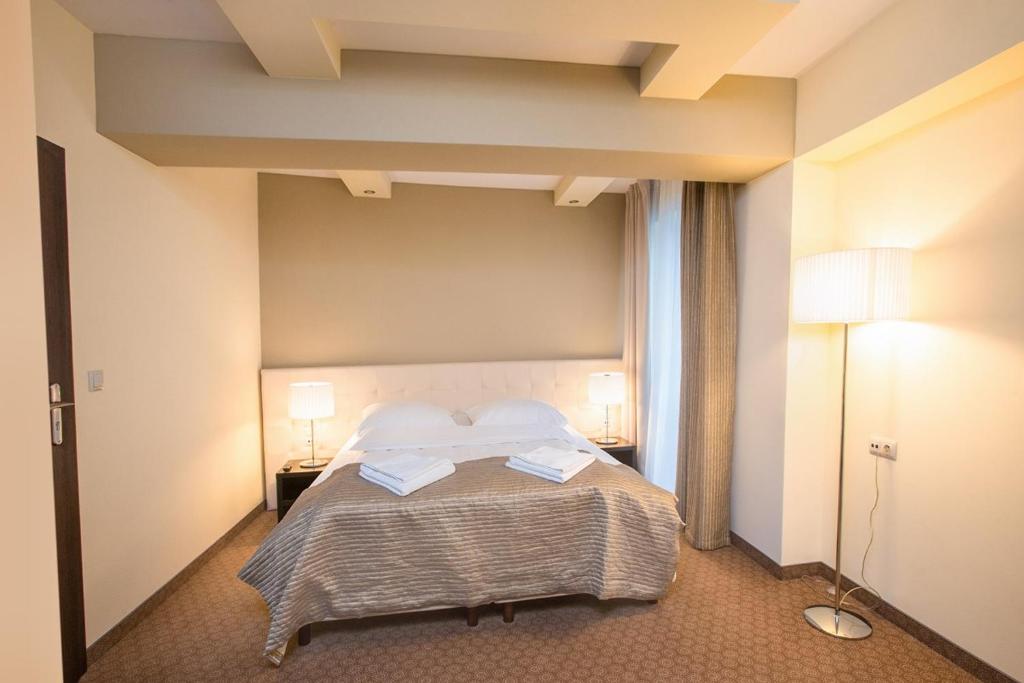 Postel nebo postele na pokoji v ubytování Hotel Zimowit