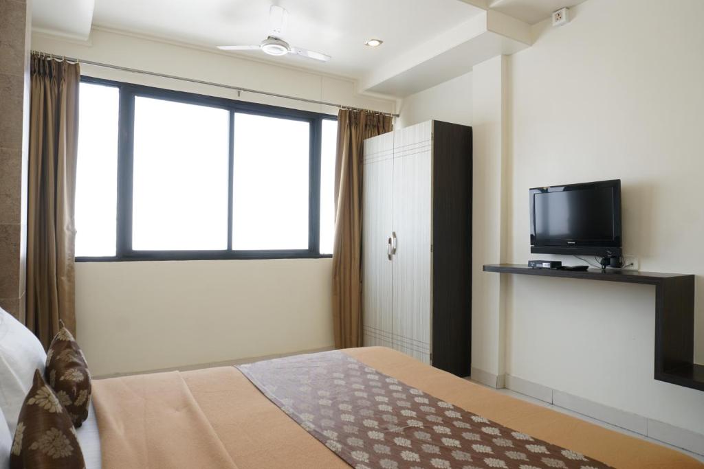 TV a/nebo společenská místnost v ubytování Hotel Pavitra