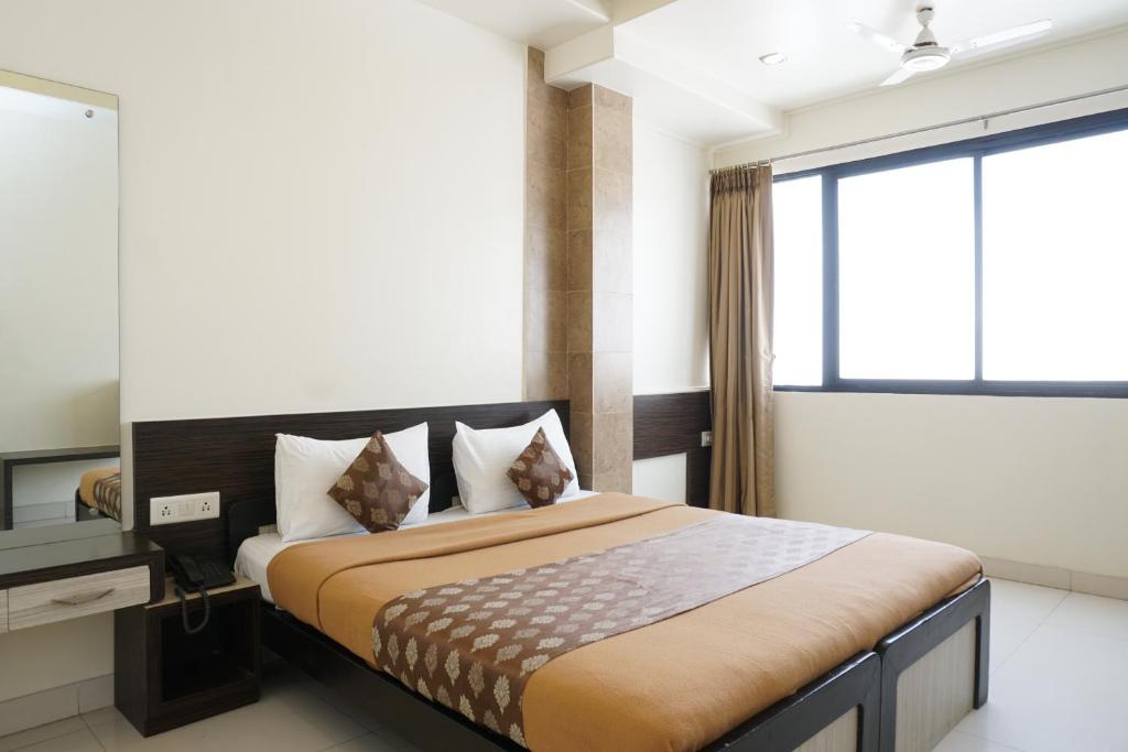 Postel nebo postele na pokoji v ubytování Hotel Pavitra