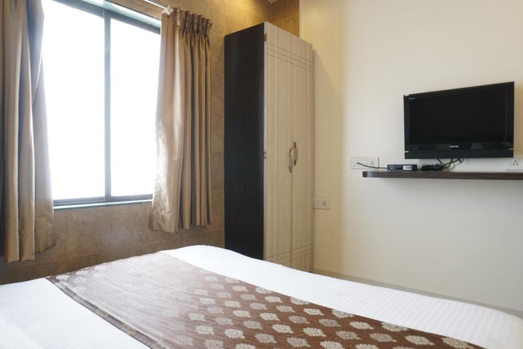 TV a/nebo společenská místnost v ubytování Hotel Pavitra