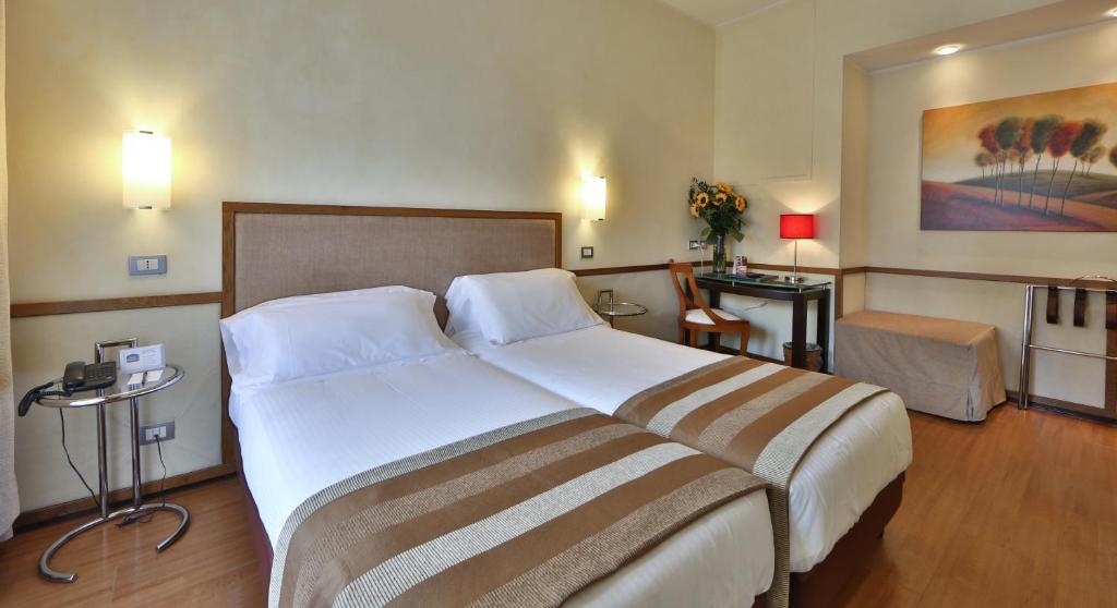 Postel nebo postele na pokoji v ubytování Best Western Hotel Piccadilly