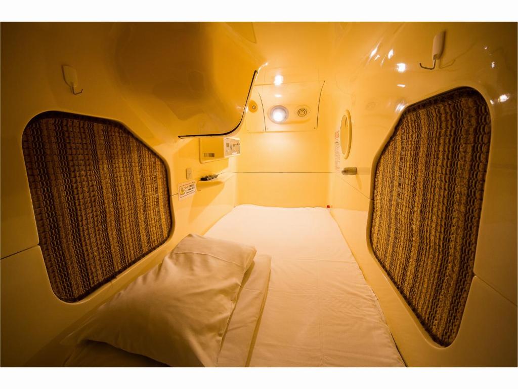 Ένα ή περισσότερα κρεβάτια σε δωμάτιο στο A-GATE Hotel Hakodate