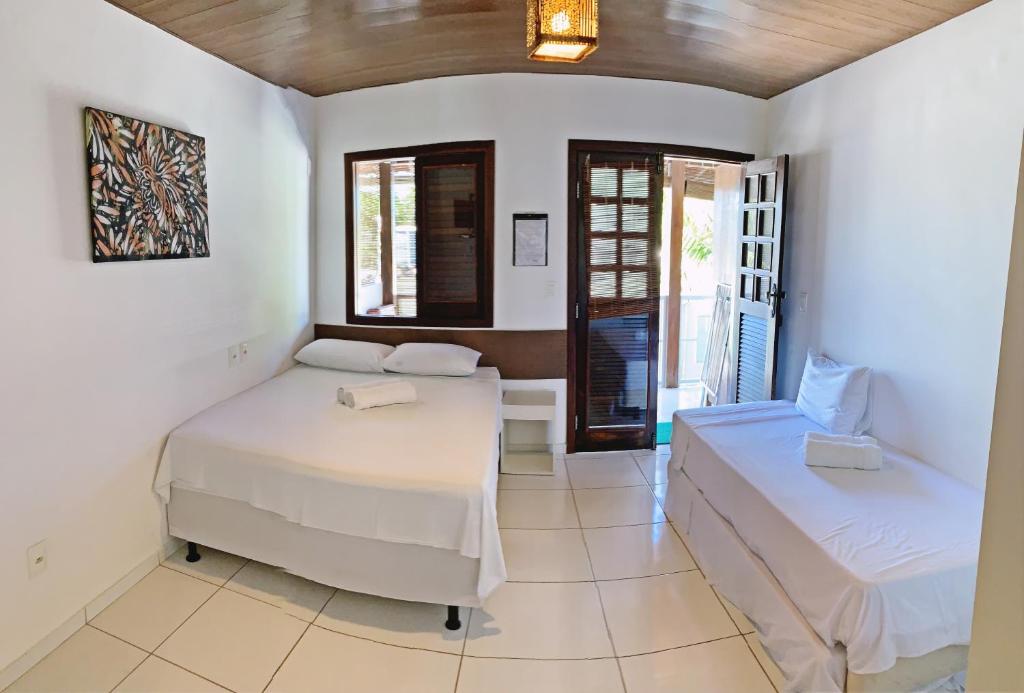 Postel nebo postele na pokoji v ubytování Pousada Brasil Caribe