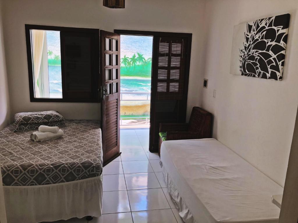 Postel nebo postele na pokoji v ubytování Pousada Brasil Caribe