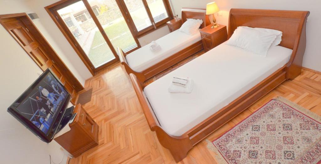 Postel nebo postele na pokoji v ubytování Mladenovic apartments