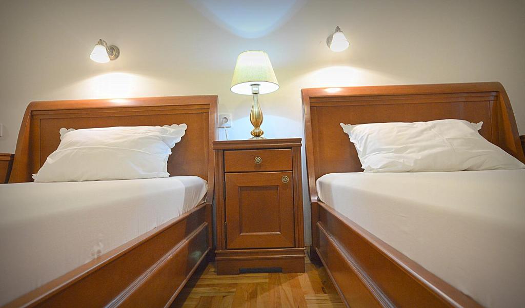 Postel nebo postele na pokoji v ubytování Mladenovic apartments