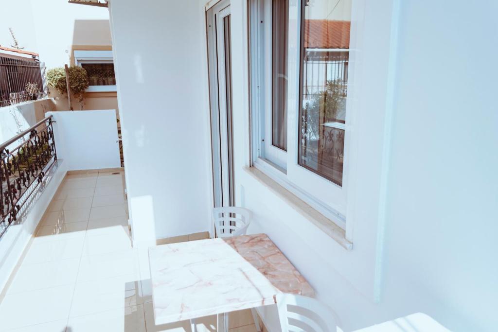 A balcony or terrace at Sun Βy Τhe Sea 100m from the beach