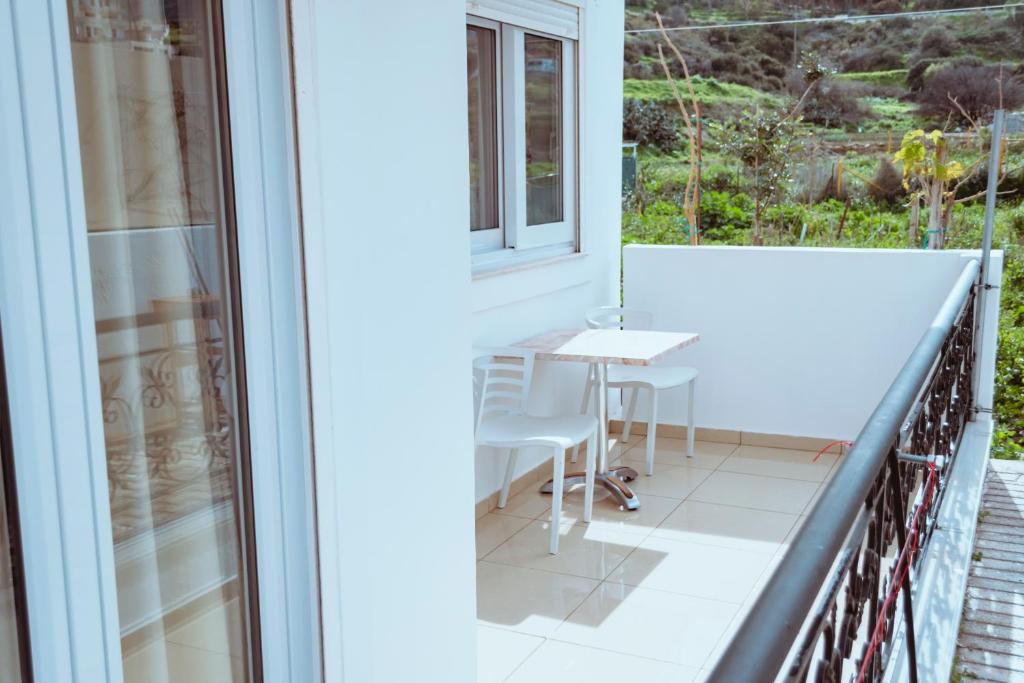 A balcony or terrace at Sun Βy Τhe Sea 100m from the beach