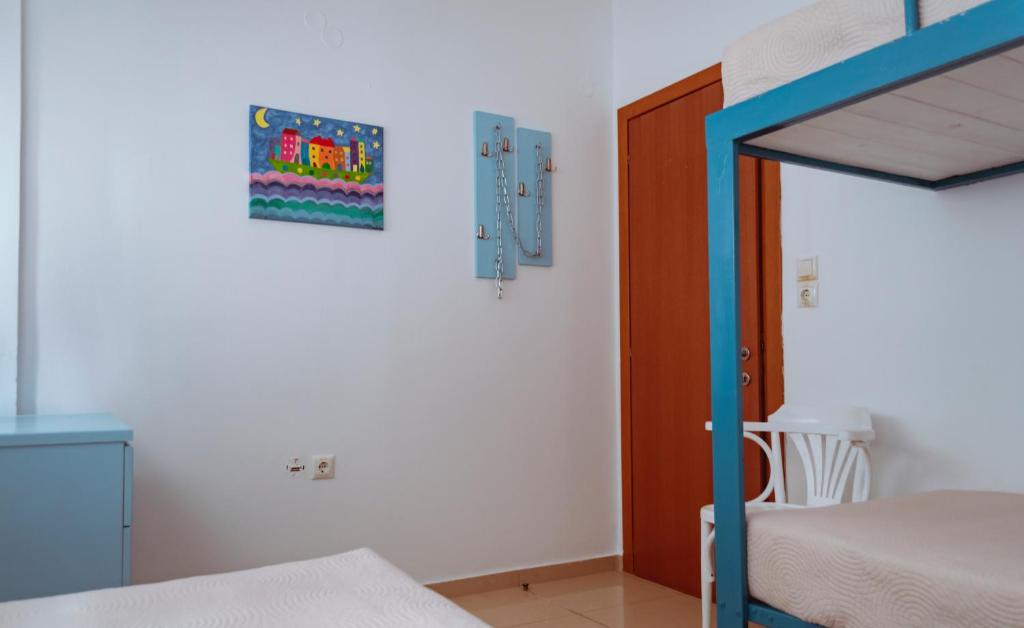 A bed or beds in a room at Sun Βy Τhe Sea 100m from the beach