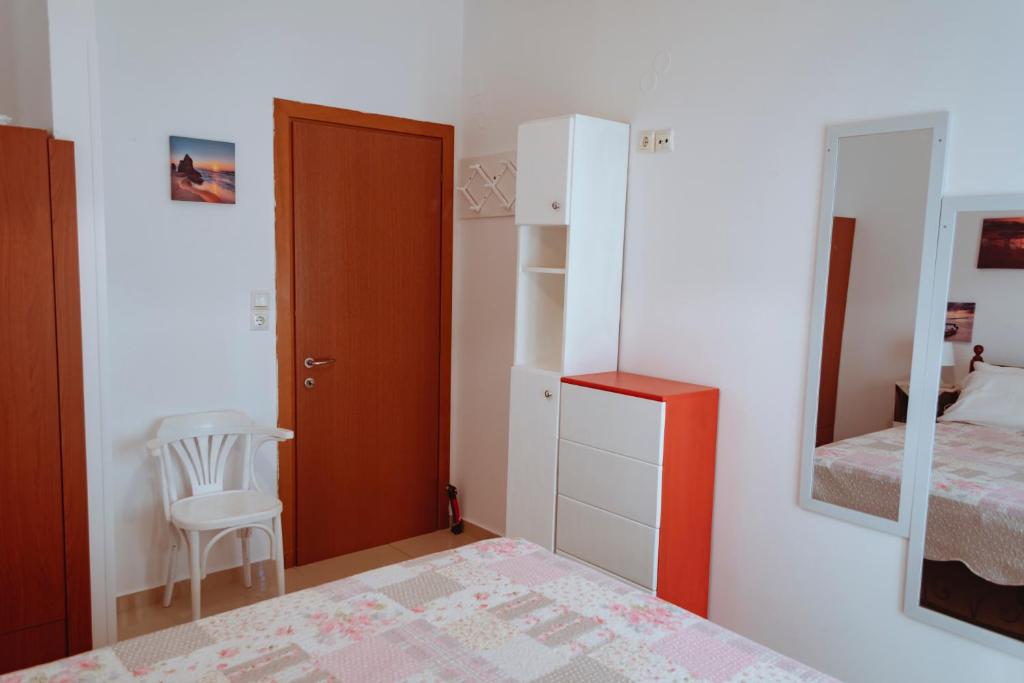 A bed or beds in a room at Sun Βy Τhe Sea 100m from the beach
